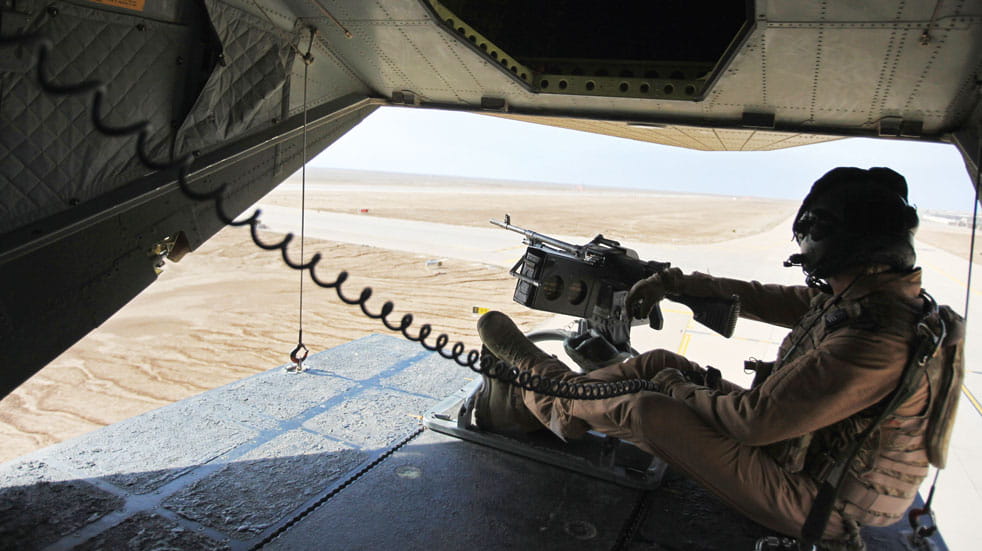 An RAF gunner watches the desert